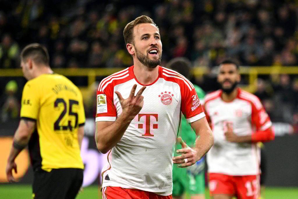 Harry Kane of Bayern Munich celebrates after scoring the team's fourth goal during the Bundesliga match between Borussia Dortmund and FC Bayern Mün...