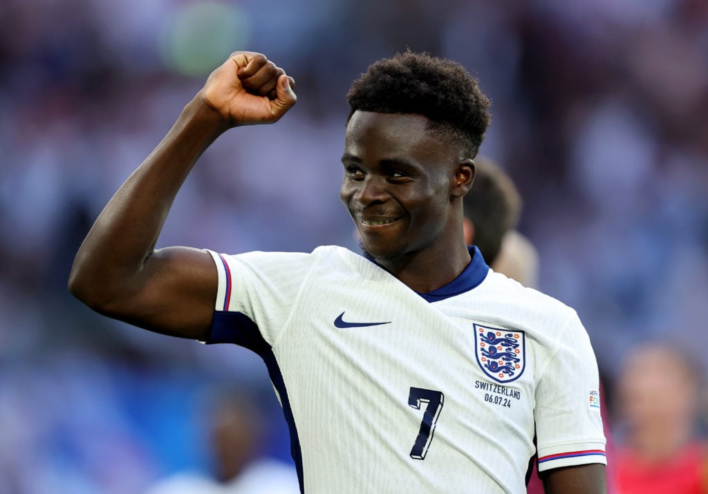 Bukayo Saka of England celebrates following the team's victory in the penalty shoot out during the UEFA EURO 2024 quarter-final match between Engla...
