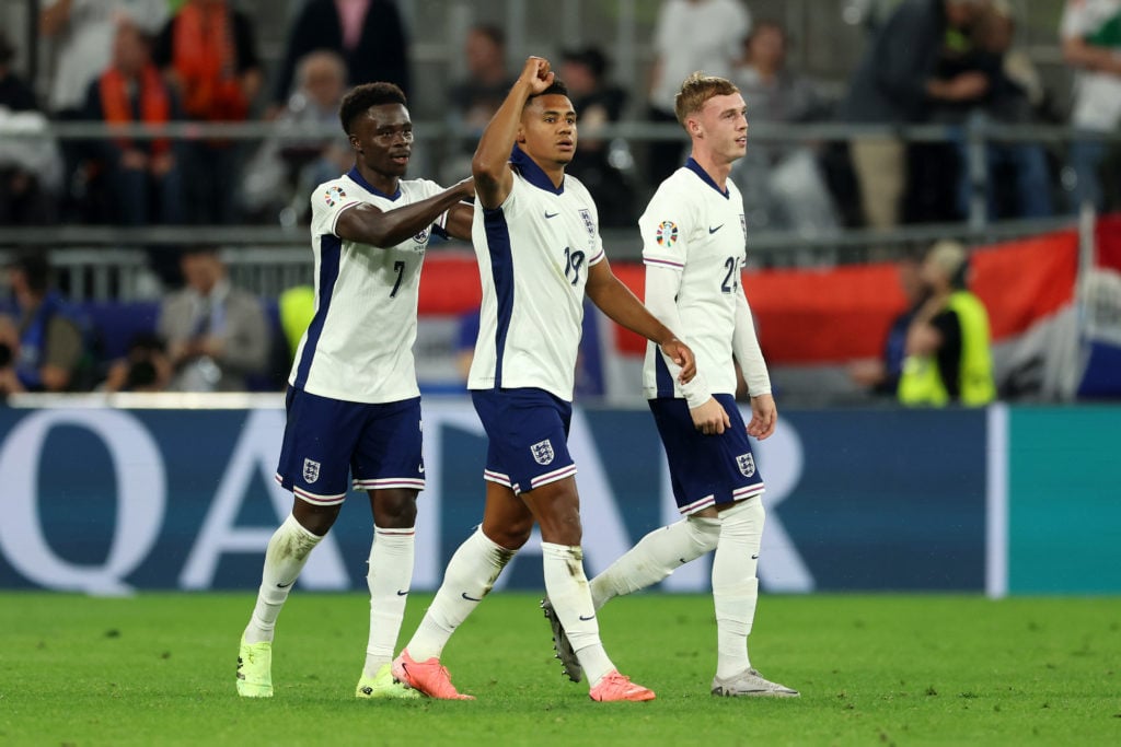 Ollie Watkins of England celebrates scoring his team's second goal with teammates Bukayo Saka and Cole Palmer during the UEFA EURO 2024 semi-final ...