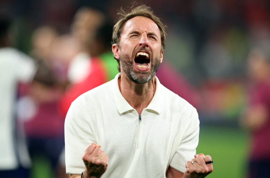 Coach Gareth Southgate of England celebrate with the fans after their sides victory the UEFA EURO 2024 semi-final match between Netherlands and Eng...