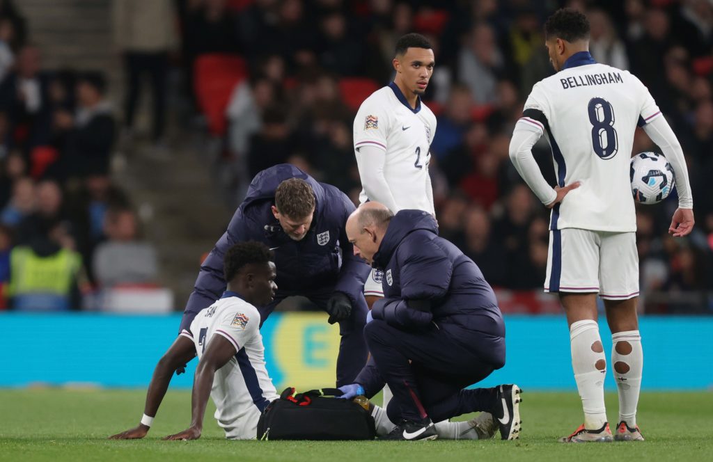 Bukayo Saka of England receives medical treatment for an injury during the UEFA Nations League 2024/25 League B Group B2 match between England and ...