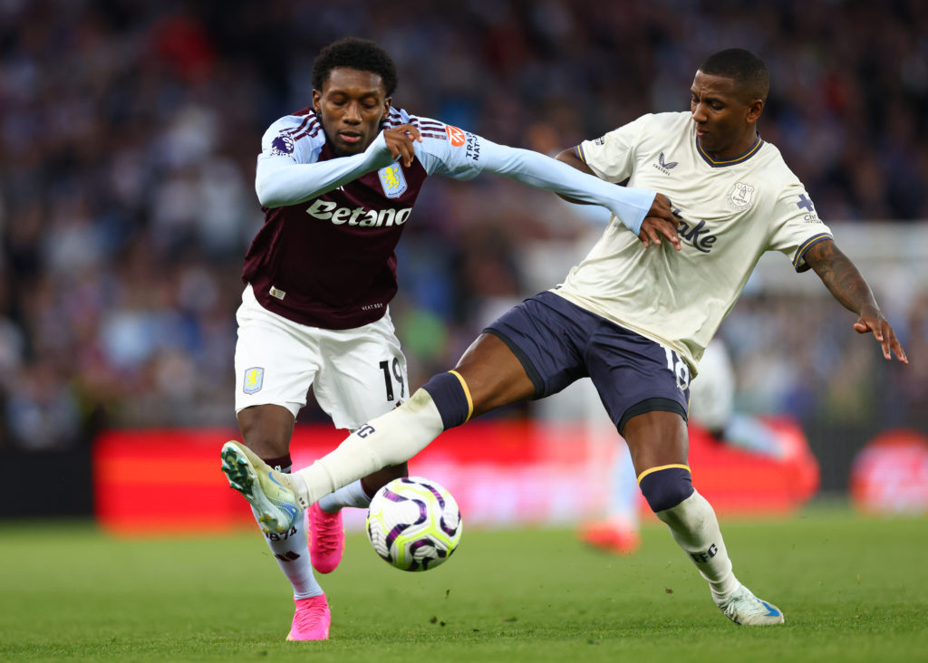 Jaden Philogene of Aston Villa in action with Ashley Young of Everton during the Premier League match between Aston Villa FC and Everton FC at Vill...