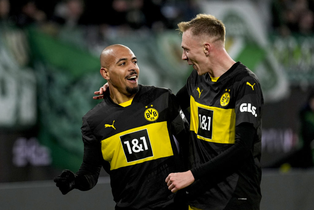 Donyell Malen of Borussia Dortmund celebrates with his teammate Maximilian Beier after scoring the 1-0 lead during the Bundesliga soccer match betw...
