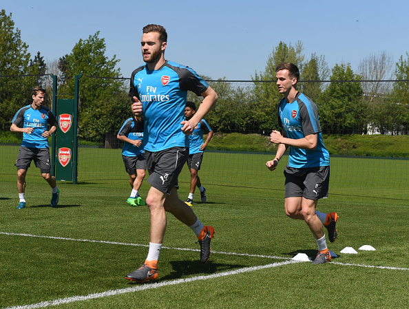 L-R0 Calum Chambers and Rob Holding of Arsenal during a training session at London Colney on May 5, 2018 in St Albans, England. (Photo by Stuart MacFarlane/Arsenal FC via Getty Images