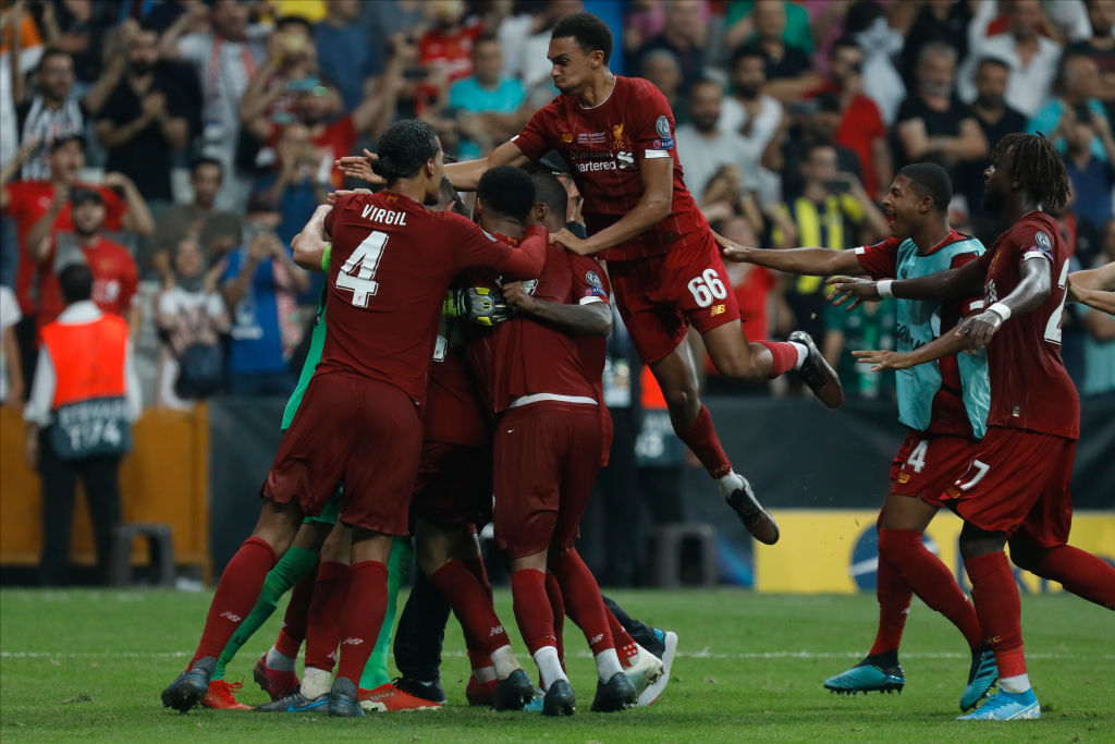 Alisson and Rhian Brewster congratulate Liverpool team-mates after Super Cup win