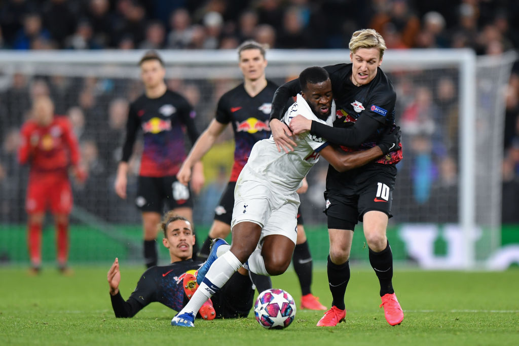Tottenham Hotspur's Tanguy Ndombele is fouled by RB Leipzig's Emil Forsberg during the UEFA Champions League round of 16 first leg match between To...
