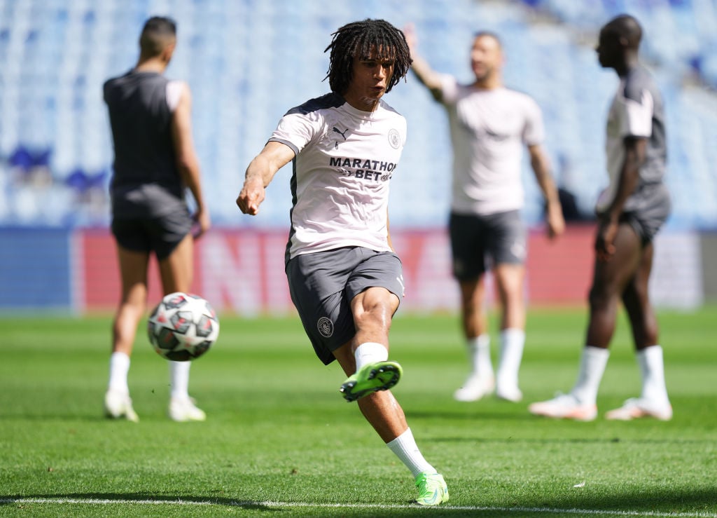 Manchester City defender Nathan Ake warming up