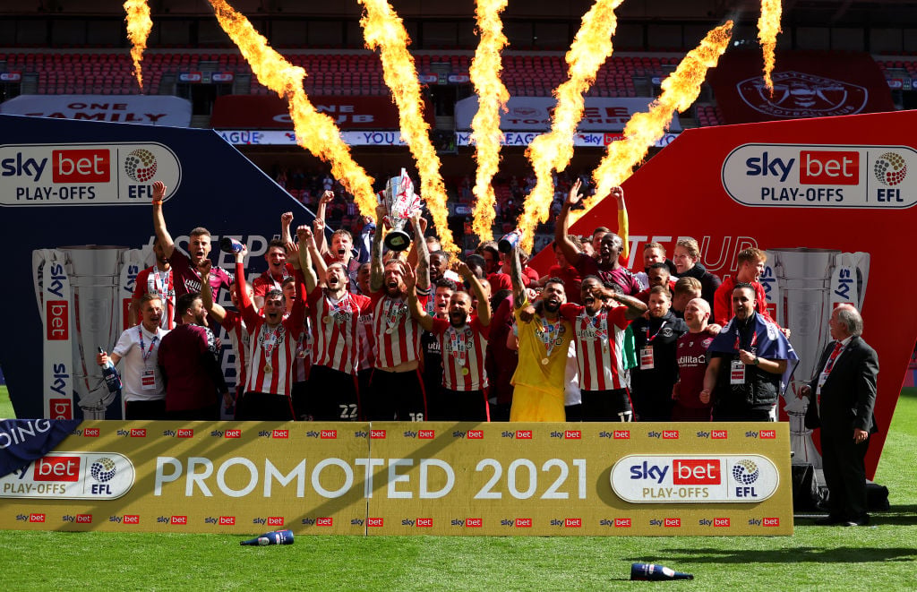 Pontus Jansson lifts the play-off final trophy for Brentford