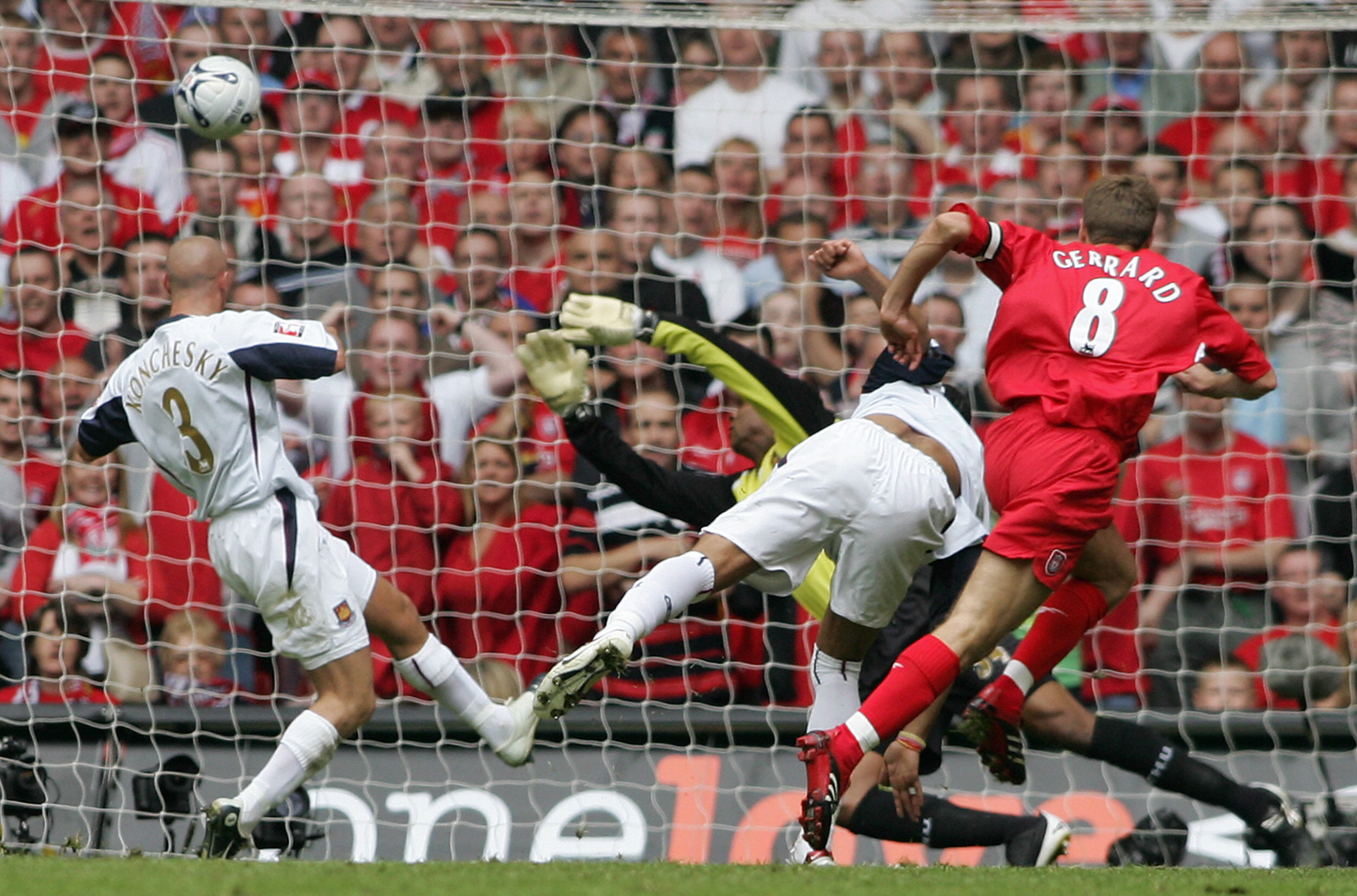 Liverpool's Steven Gerrard (R) puts the