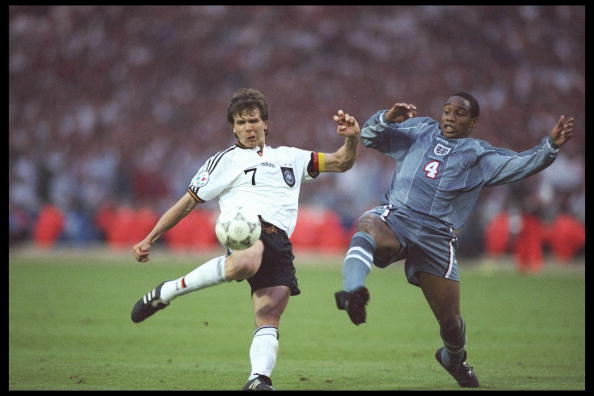 Andreas Moller of Germany left is challenged with Paul Ince of Engalnd