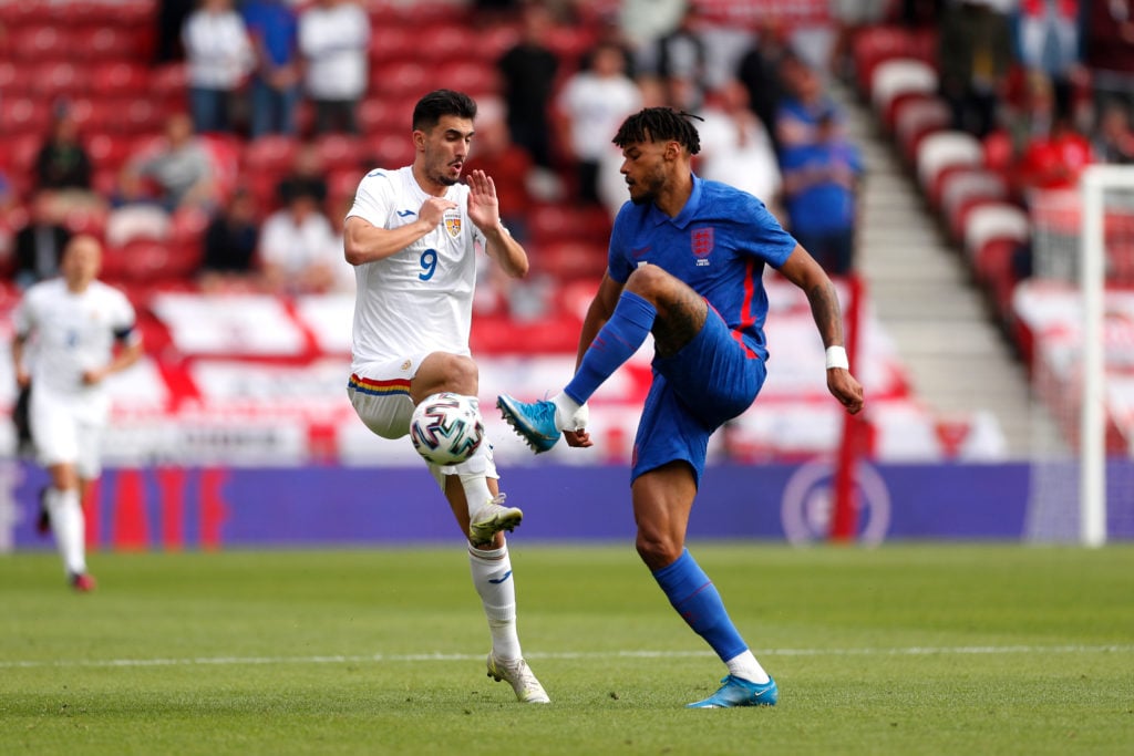 aston-villa-defender-tyrone-mings-england-three-lions-battles-for-ball-romania-andrei-ivan-riverside-stadium-euro-2020-warm-up-friendly