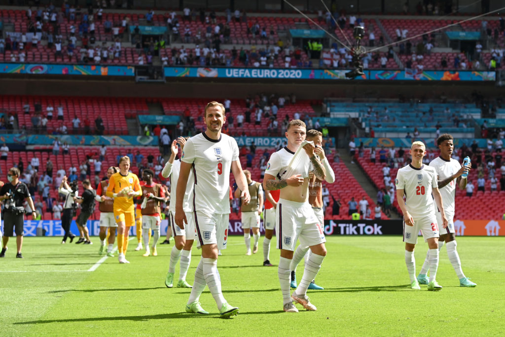 tottenham-hotspur-striker-harry-kane-applauds-fans-with-atletico-madrid-defender-kieran-trippi-england-euro-2020-croatia-wembley