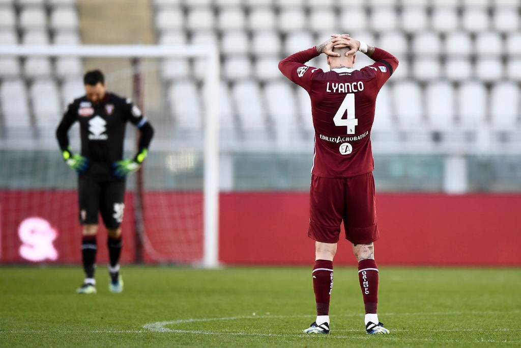 Lyanco Vojnovic (R) of Torino FC looks dejected at the end