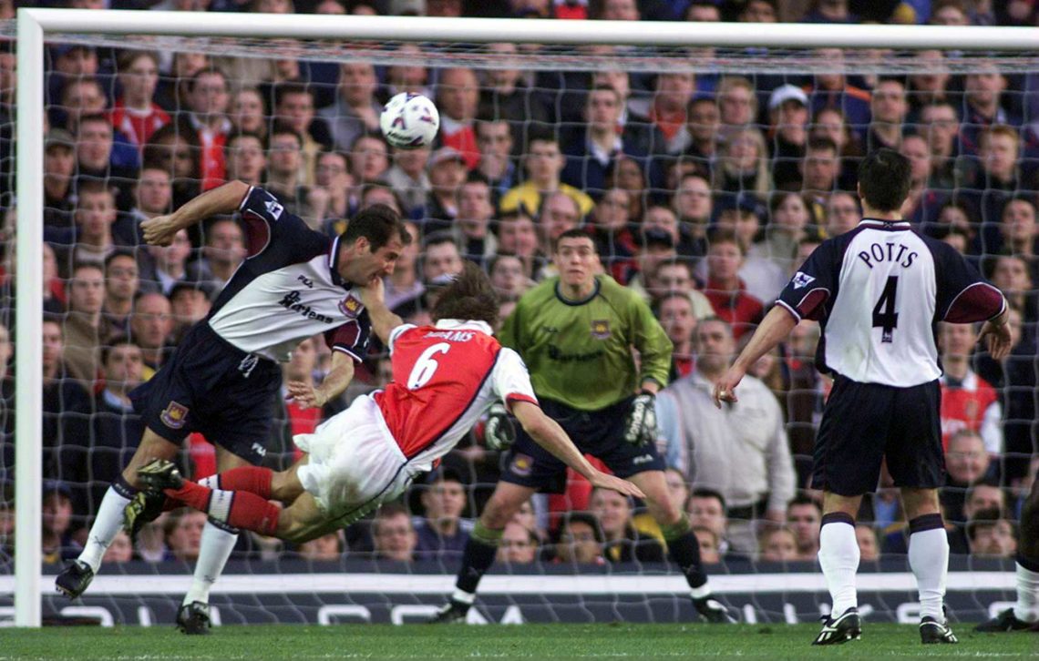 2 May 2000: Tony Adams of Arsenal has a header at the goal of Stephen Bywaters of West Ham goal during the match between Arsenal and West Ham Unite...