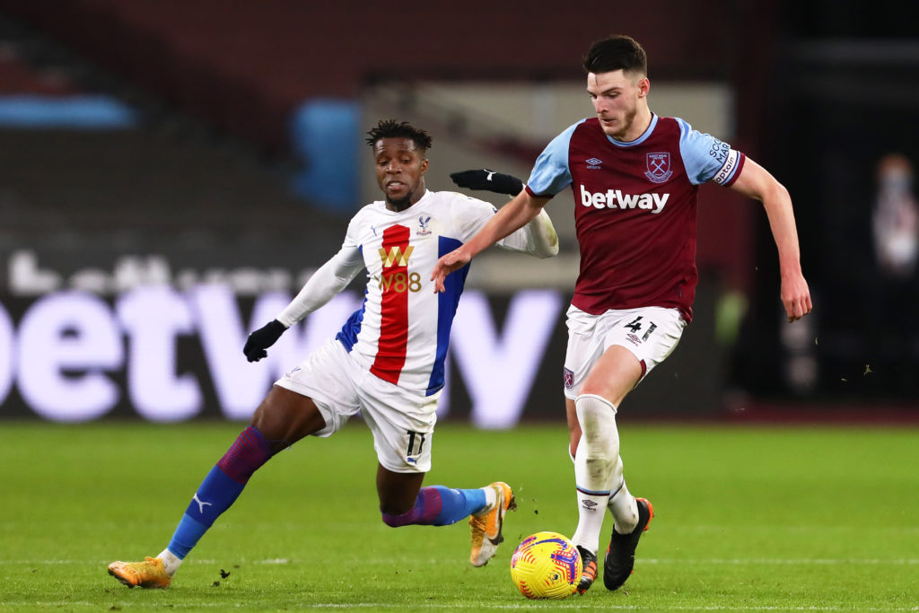 Declan Rice of West Ham United and Wilfried Zaha of Crystal