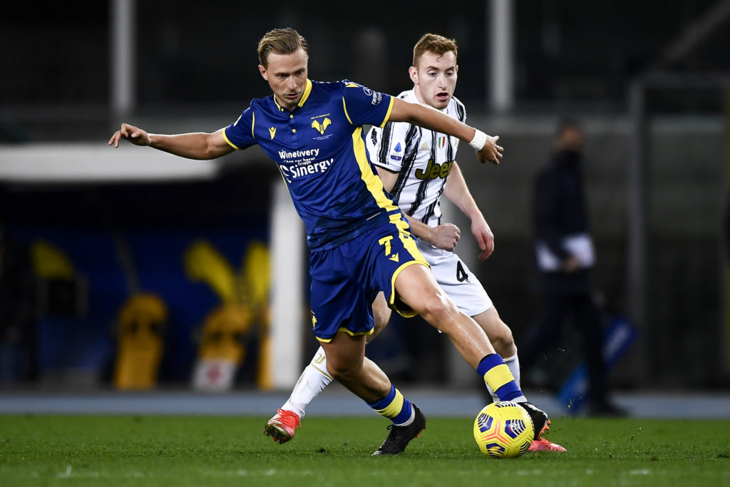Antonin Barak (L) of Hellas Verona is challenged by Dejan
