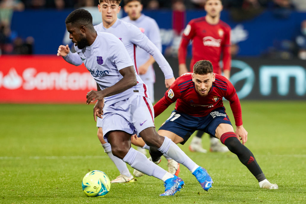 Kike Barja (R), midfielder of CA Osasuna, and Samuel Umtiti