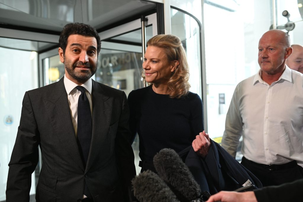 Newcastle United's new director Amanda Staveley (C) and husband Mehrdad Ghodoussi (L) talk to the media as she leaves the foyer of St James' Park i...