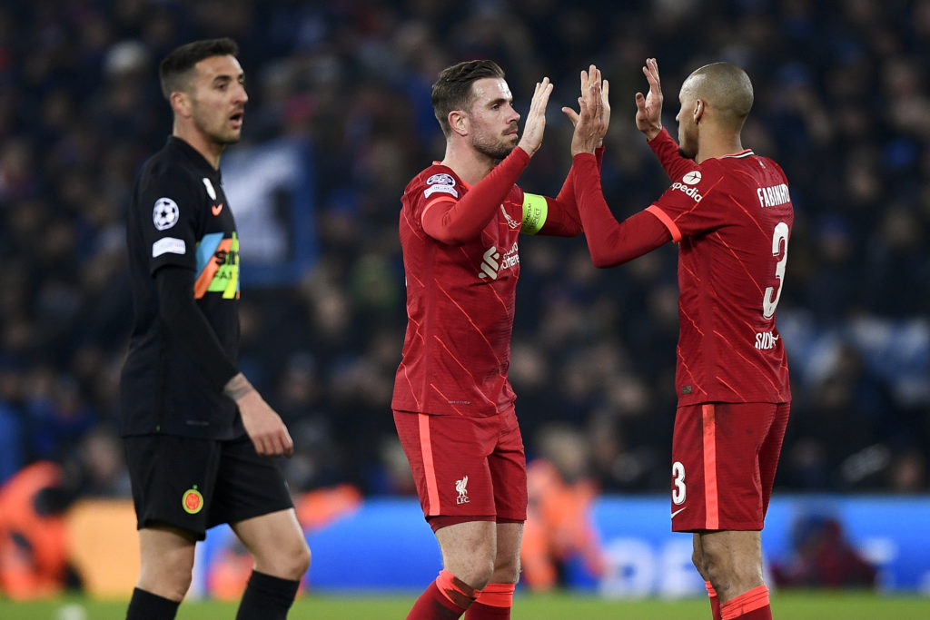 Jordan Henderson (C) of Liverpool FC celebrates with Fabio