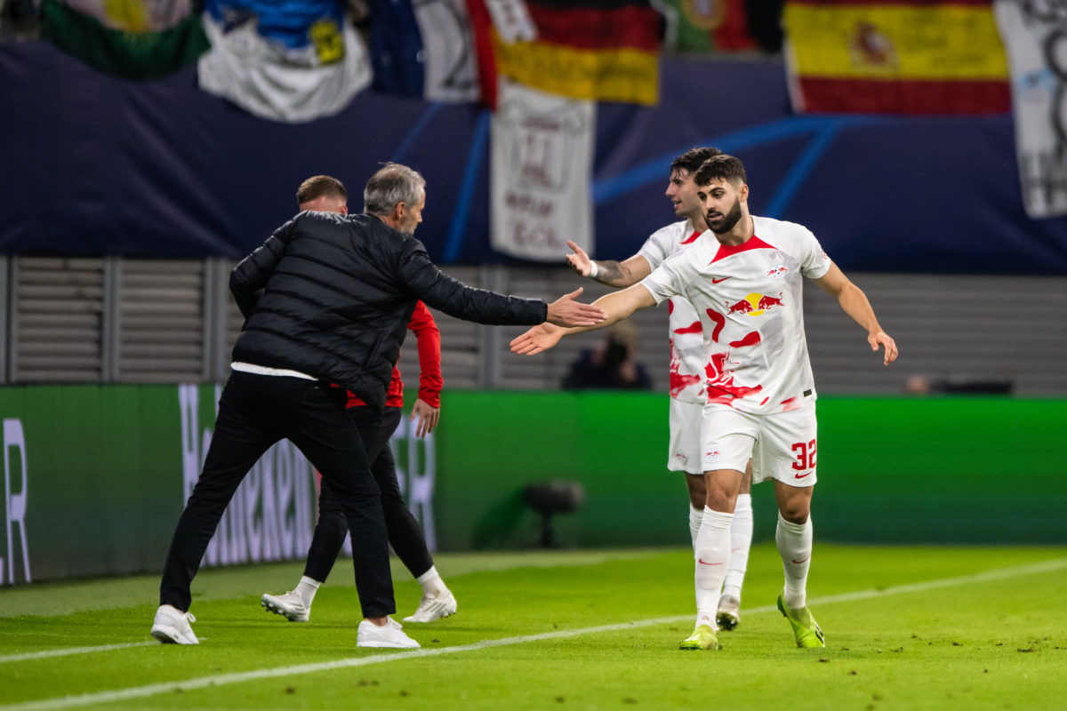LEIPZIG, GERMANY - OCTOBER 25: Josko Gvardiol (R) of RB Leipzig celebrates after scoring his team's first goal with Head Coach Marco Rose (L) of RB...