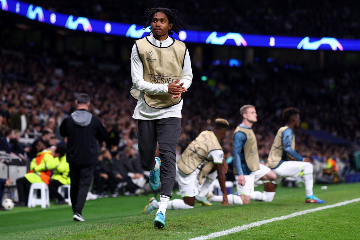 LONDON, ENGLAND - OCTOBER 26: Djed Spence of Tottenham Hotspur reciprocates applause from the Tottenham supporters whist warming up during the UEFA...