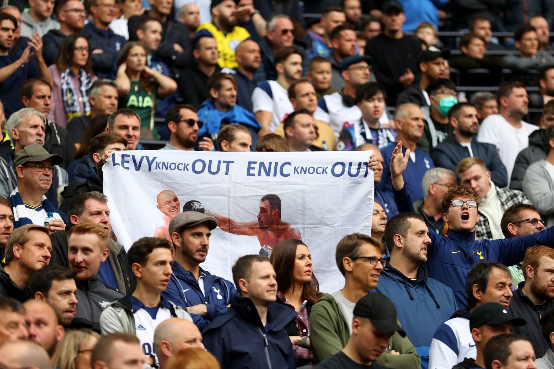 A Tottenham Hotspur fan holds a protest banner against Tottenham Chairman Daniel Levy and ENIC prior to the Premier League match between Tottenham ...