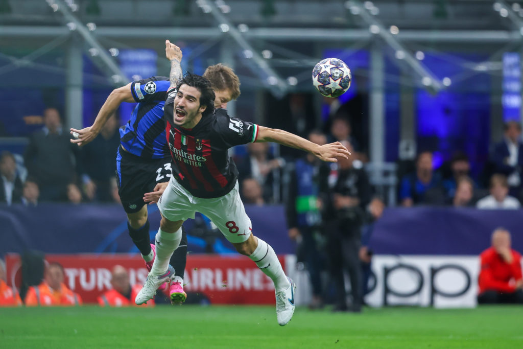 Sandro Tonali of AC Milan competes for the ball with Nicolo