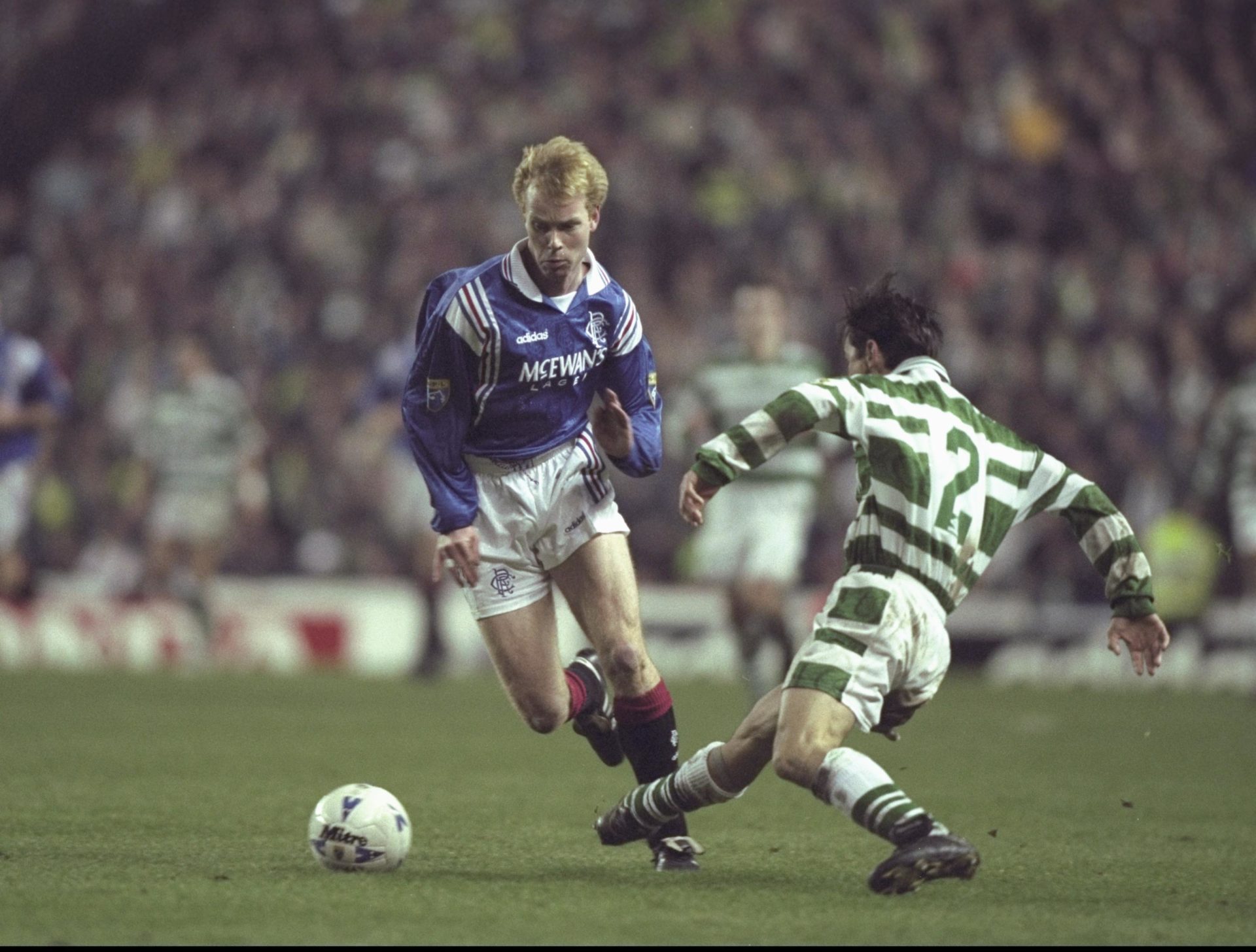 Erik Bo Andersson of Rangers (left) goes round the challenge of Jackie McNamara of Celtic