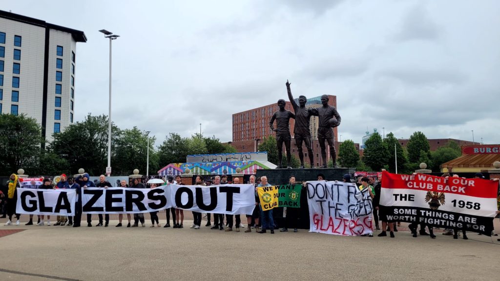 Man Utd fans protest the new kit launch at the Old Trafford megastore