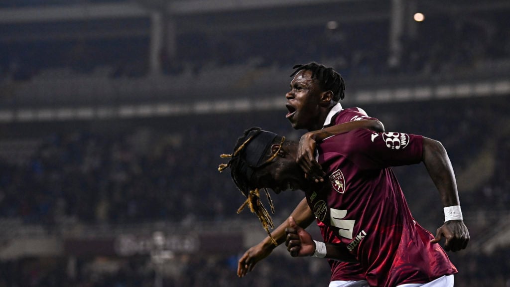 Yann Karamoh (L) of Torino FC celebrates with Wilfried Singo