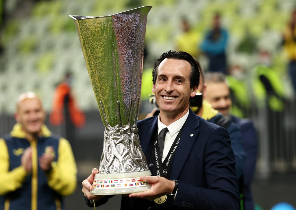 Unai Emery celebrates with the UEFA Europa League Trophy following victory in the UEFA Europa League Final between Villarreal CF and Manchester United