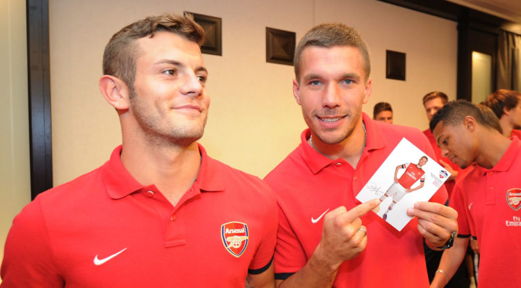 Lukas Podolski, Aaron Ramsey and Arsenal coach Jack Wilshere react to news coming out this morning