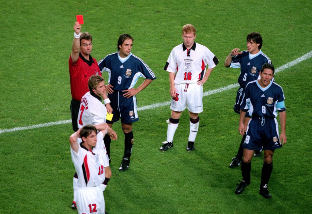 English midfielder David Beckham receives red card against Argentina at 1998 World Cup amid Glenn Hoddle responding to Netflix accusations