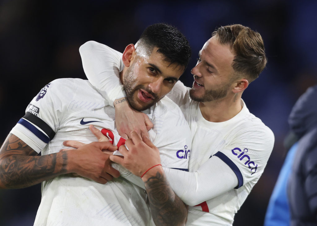 James Maddison embraces Cristian Romero during a Tottenham game