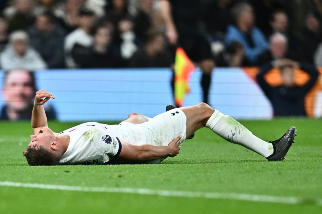 Micky van de Ven of Tottenham Hotspur injured during the Premier League match between Tottenham Hotspur and Chelsea FC at Tottenham Hotspur Stadium...