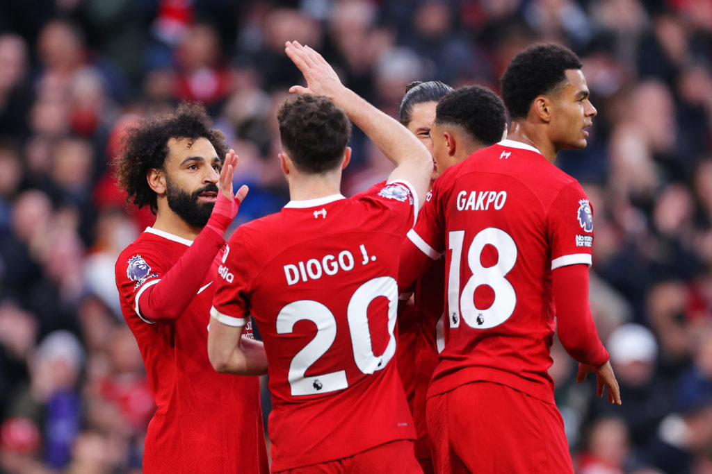 Mohamed Salah of Liverpool celebrates with teammate Diogo Jota after scoring the team's first goal during the Premier League match between Liverpoo...