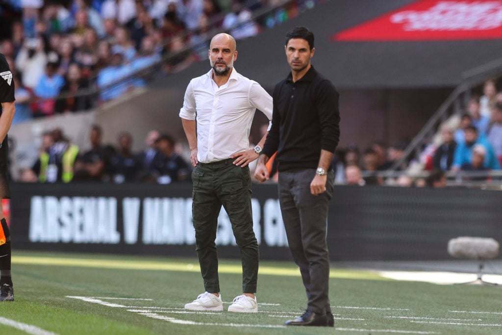 Head Coaches Pep Guardiola of Manchester City with Mikel Arteta of Arsenal during The FA Community Shield match between Manchester City against Ars...