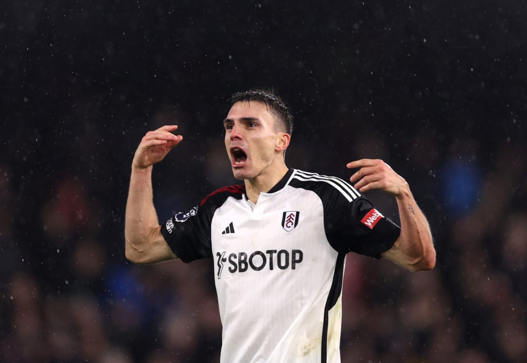 Joao Palhinha of Fulham celebrates at full-time during the Premier League match between Fulham FC and Arsenal FC at Craven Cottage on December 31, ...