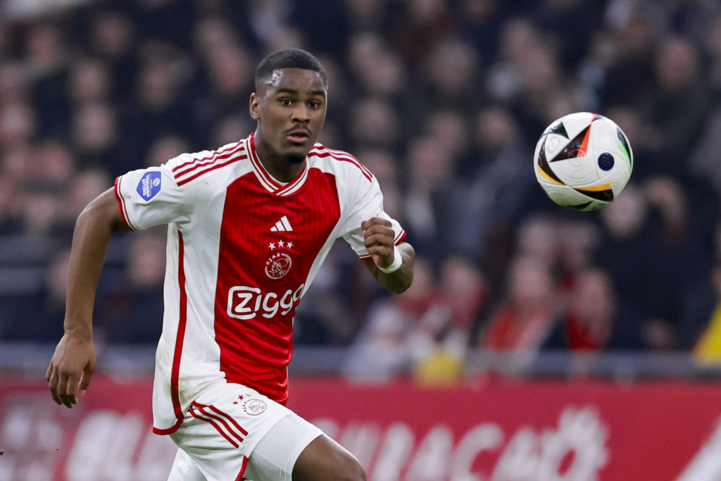 Jorrel Hato of AFC Ajax controls the ball during the Dutch Eredivisie match between AFC Ajax and PSV Eindhoven at Johan Cruijff Arena on February 3, 2024