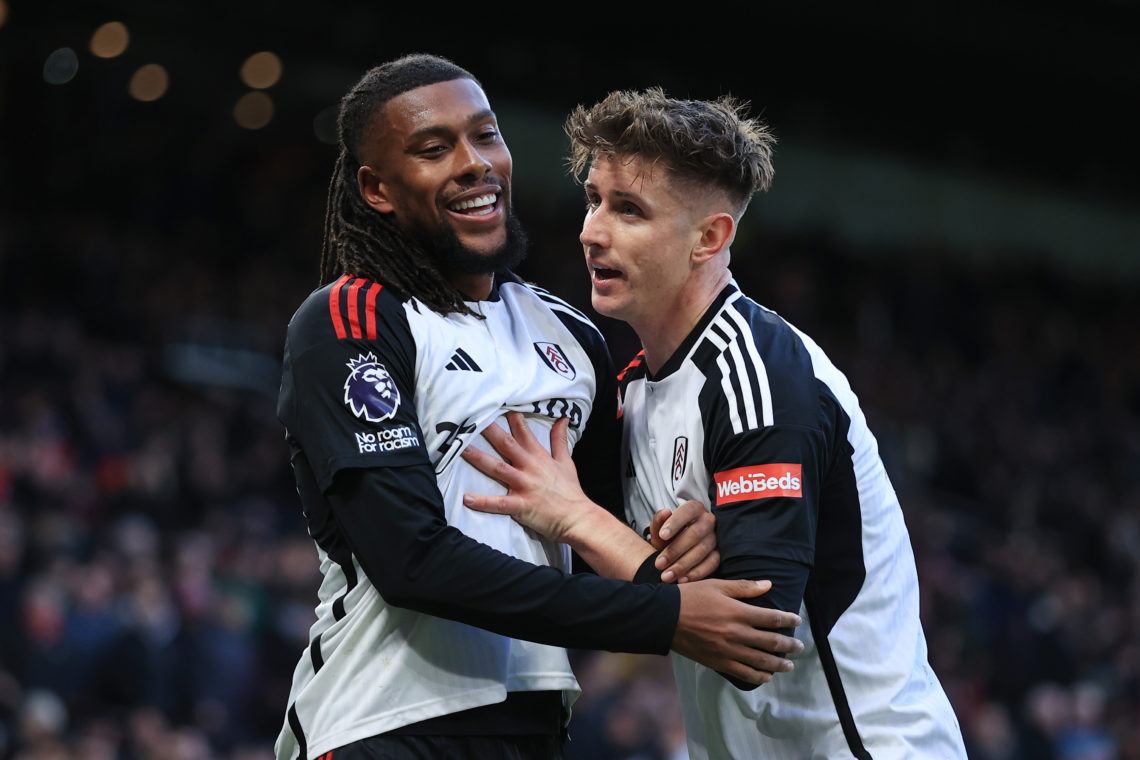 Alex Iwobi of Fulham (L) celebrates with Tom Cairney of Fulham after scoring their 2nd goal during the Premier League match between Manchester Unit...