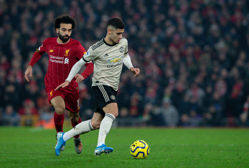 Manchester United's Andreas Pereira gets away from Liverpool's Mohamed Salah during the Premier League match between Liverpool FC and Manchester Un...
