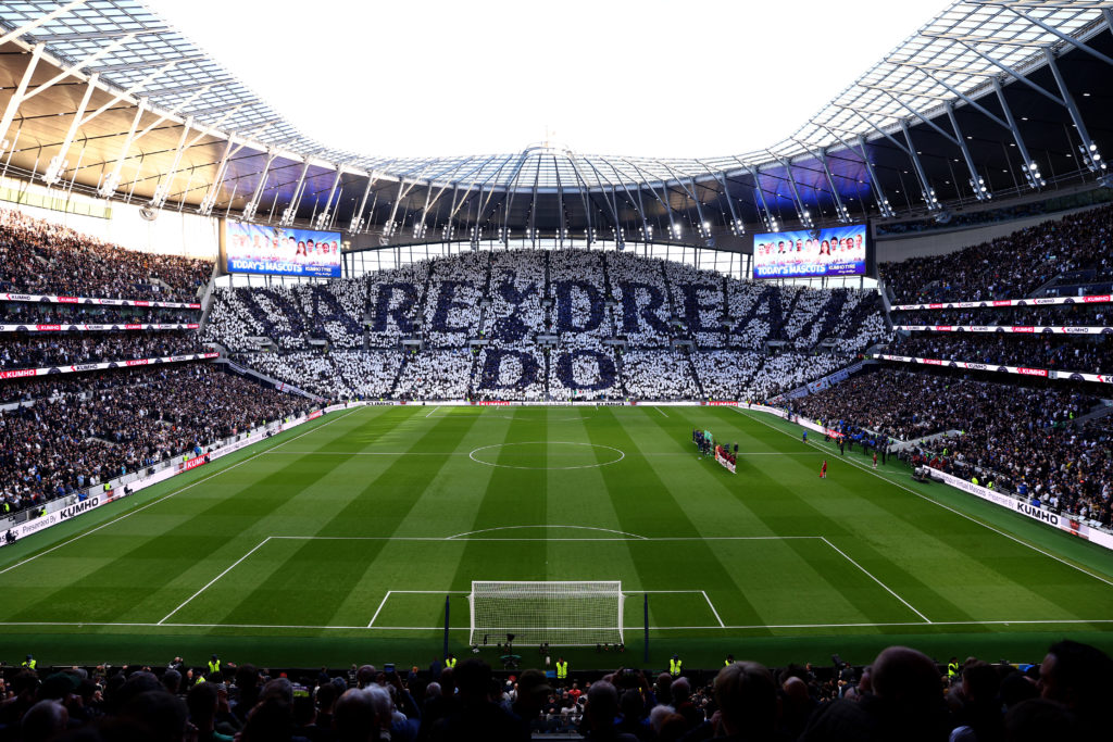 A general view inside the stadium as fans hold up pieces of fabric to display a message of 'Dare Dream Do' prior to the Premier League match betwee...