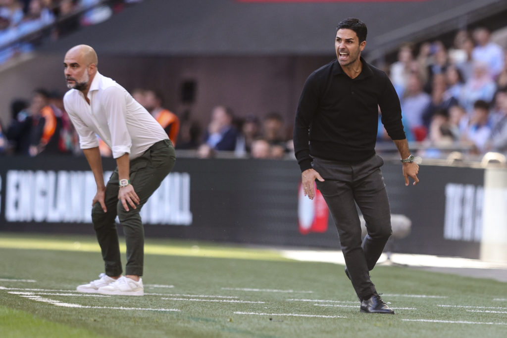Head Coaches Pep Guardiola of Manchester City with Mikel Arteta of Arsenal during The FA Community Shield match between Manchester City against Ars...