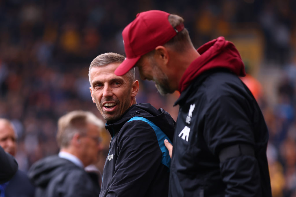 Gary O'Neil, Manager of Wolverhampton Wanderers, and Juergen Klopp, Manager of Liverpool, interact prior to the Premier League match between Wolver...