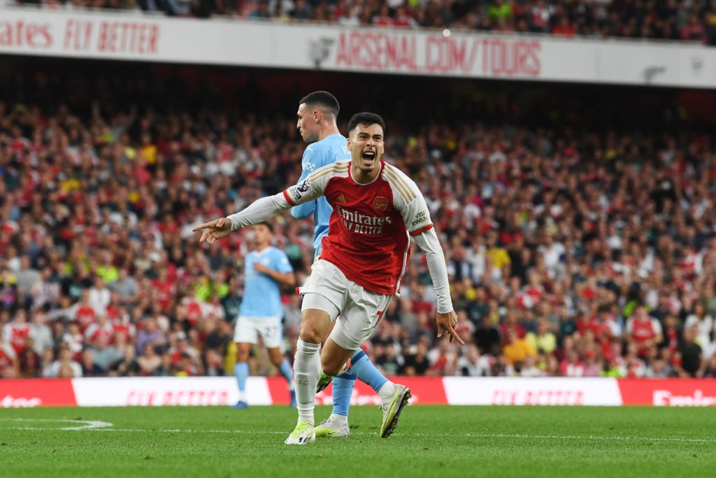 Gabriel Martinelli of Arsenal celebrates after scoring their sides first goal during the Premier League match between Arsenal FC and Manchester Cit...