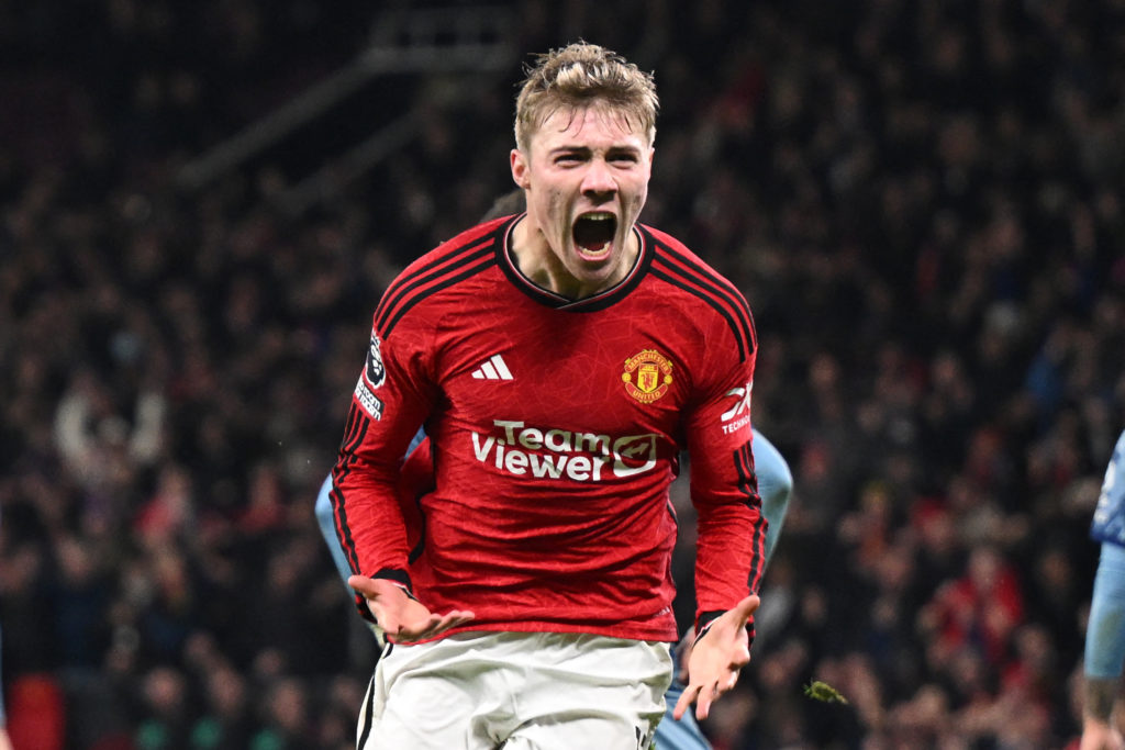 Manchester United's Danish striker #11 Rasmus Hojlund celebrates after scoring their third goal during the English Premier League football match be...