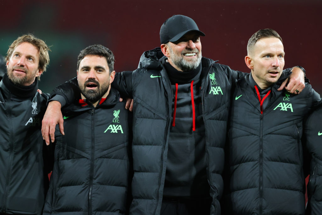 Jurgen Klopp, manager of Liverpool, (C) and assistant manager Pepijn Lijnders during the Carabao Cup Final match between Chelsea and Liverpool at W...