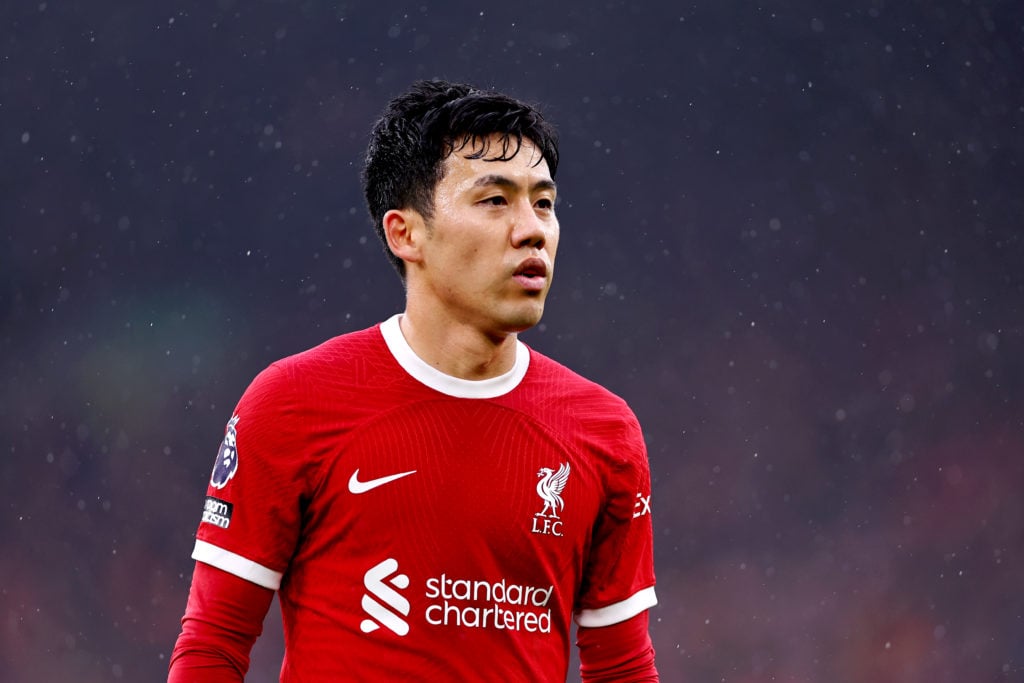 Wataru Endo of Liverpool looks on during the Premier League match between Liverpool FC and Manchester City at Anfield on March 10, 2024 in Liverpoo...