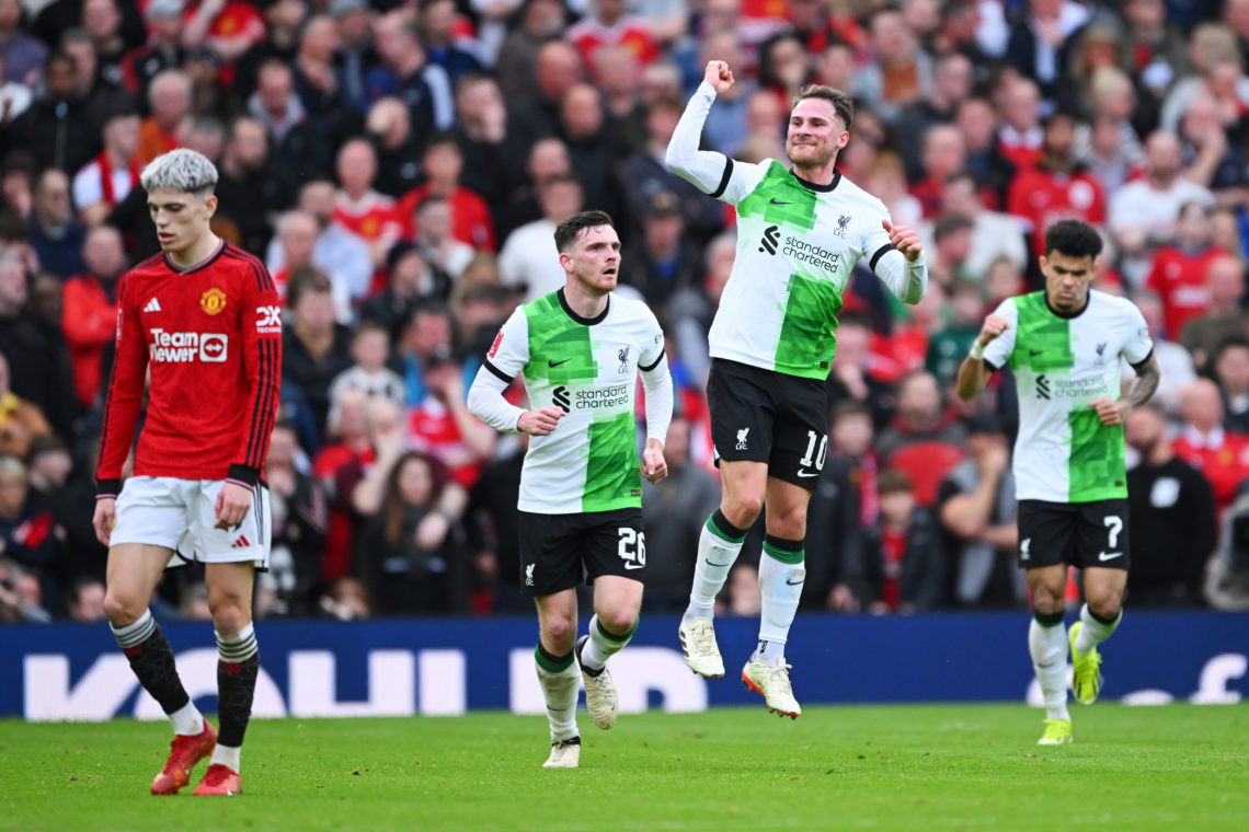 Alejandro Garnacho of Manchester United looks dejected as Alexis Mac Allister of Liverpool celebrates scoring his team's first goal with teammates ...