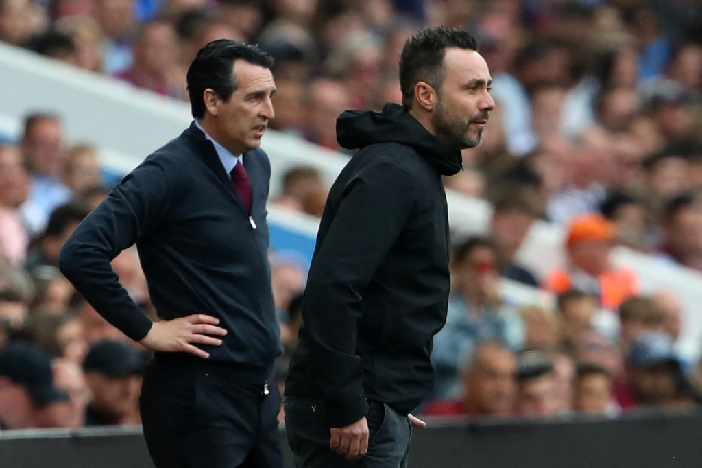 Aston Villa's Spanish head coach Unai Emery (L) and Brighton's Italian head coach Roberto De Zerbi (R) look on during the English Premier League fo...